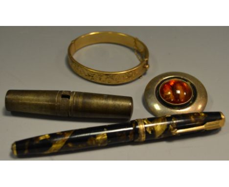 A Norwegian silver target brooch, marked F..E. From Norway, 92;  a gold plated hinged bangle;  a fountain pen