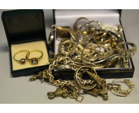 A 9ct gold topaz dress ring; a 14ct gold red stone solitaire; various silver rings; bangles; necklaces; etc