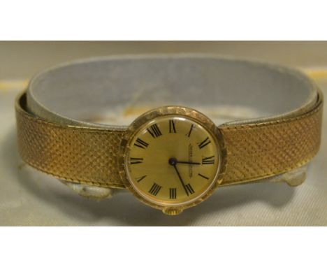 A Jaeger-Le Coultre lady's 9ct gold wrist watch, manual movement, gold dial, black Roman numerals, integral 9ct gold bracelet