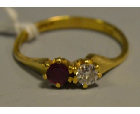 A diamond and ruby duet ring, each round cut stone approx 0.25ct,   18ct gold shank, size Q/R, London 1977, 3g gross