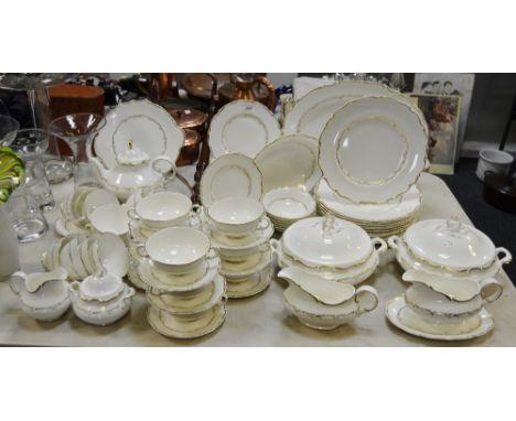 A Royal Doulton Richelieu pattern dinner and tea service comprising teapot; milk; sucrier; meat plate; 12 cups and saucers; 9