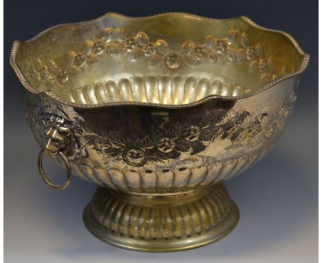 A large E.P. on copper half fluted punch bowl, embossed with flowers and foliage, lion mask ring loop handles, gadrooned rim,