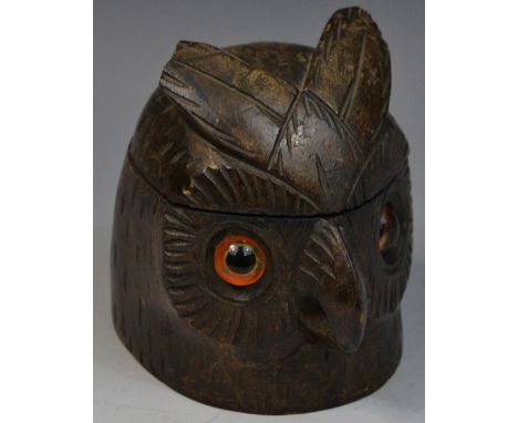 A Black Forest novelty inkwell, carved as the head of an owl, hinged cover enclosing two ceramic liners, glass eyes, 9.5cm hi