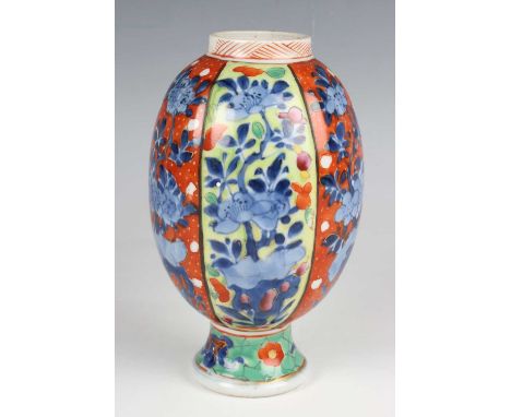 A Chinese 'clobbered' blue and white porcelain jar, Kangxi period and later, the lobed ovoid body painted in underglaze blue 