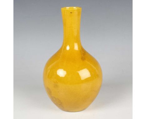 A Chinese yellow glazed bottle vase, mark of Qianlong but later Qing dynasty, the globular body with slightly flared narrow n