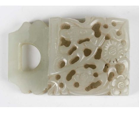 A Chinese pale celadon jade belt buckle section, Qing dynasty, the curved front panel carved and pierced with lingzhi fungus,