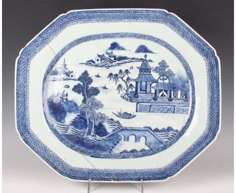 A Chinese blue and white export porcelain meat dish, late Qianlong period, painted with a bridge, pavilions, boat and trees i