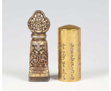 A Tibetan iron seal, 16th/17th century, with silvered and gilt detail, the trilobed finial and tapered shaft cast in relief w