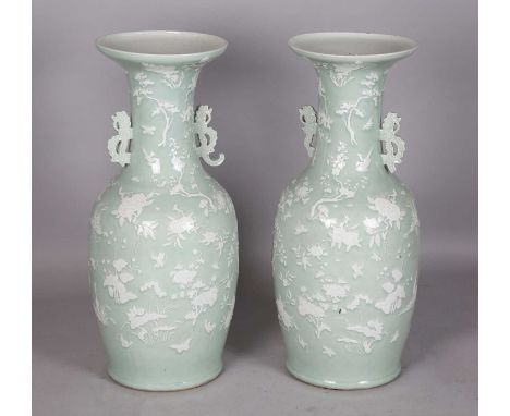A pair of large Chinese white enamelled celadon ground porcelain vases, 19th century, each ovoid body and flared neck decorat