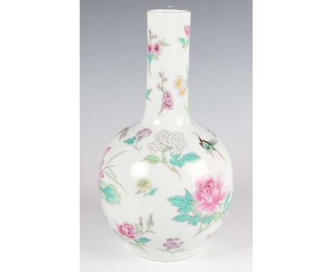 A Chinese famille rose porcelain bottle vase, mark of Qianlong but probably Republic period, decorated with scattered flowers