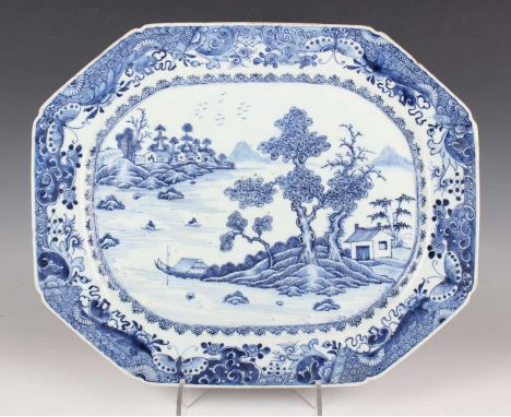 A Chinese blue and white export porcelain meat dish, Qianlong period, painted with boats, pavilions and trees in a coastal la