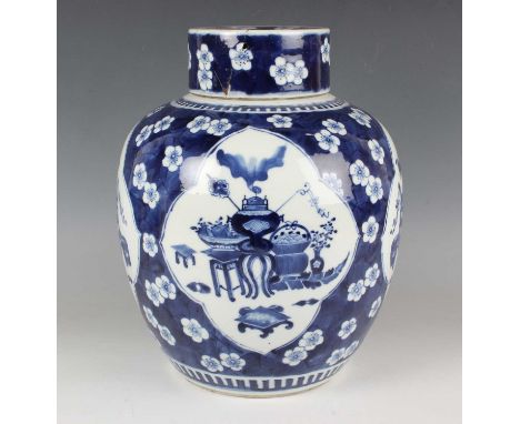 A Chinese blue and white porcelain ginger jar and cover, mark of Kangxi but late 19th century, the ovoid body painted with pa