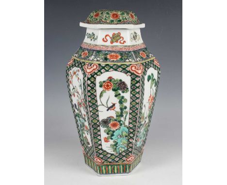 A Chinese famille verte hexagonal porcelain jar and domed cover, late Qing dynasty, painted with panels of birds and flowers 