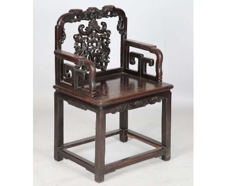 A Chinese hardwood armchair, late Qing dynasty, the shaped top rail carved with a bat above a carved and pierced splat back d