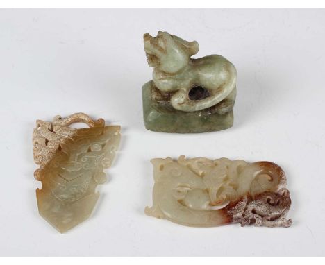 Two Chinese archaistic jade pendants, probably 20th century, one carved and pierced with a dragon, length 8cm, the other with