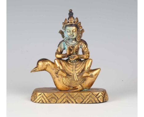 A Sino-Tibetan gilt bronze figure of a bodhisattva, possibly Amitabha, 18th century, finely modelled seated on the back of a 