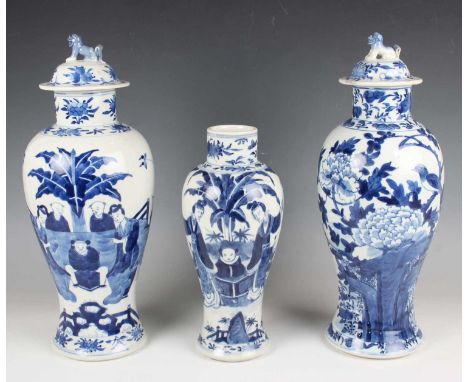 Two Chinese blue and white porcelain vases and covers, marks of Kangxi but late 19th century, each of baluster form, one pain