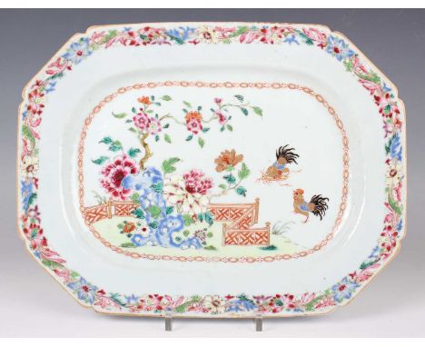 A Chinese famille rose export porcelain meat dish, Qianlong period, painted and gilt with two cockerels beside a fenced peony
