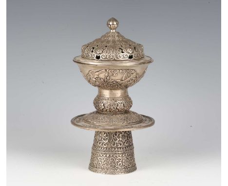 A Himalayan cast silvered metal incense burner and cover, 20th century, the domed cover cast and pierced with bud finial abov