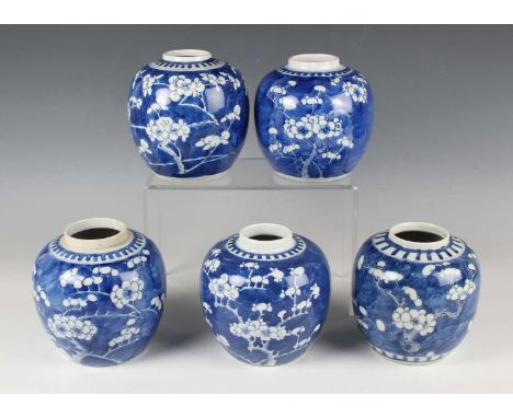A Chinese blue and white porcelain ginger jar, mark of Kangxi but late 19th century, painted with blossoming prunus branches,