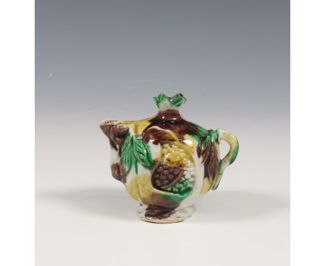China, a sancai-glazed water-dropper, Kangxi period (1662-1722), shaped as a pomegranate and covered with amber, aubergine an