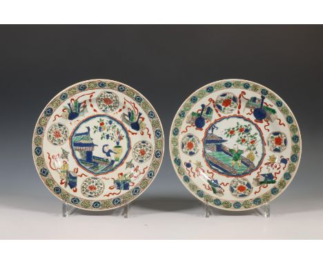 China, a near pair of famille verte porcelain plates, Kangxi period (1662-1722), each decorated with a central cartouche encl