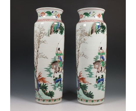 China, a pair of famille verte porcelain vases, modern, each decorated in the Kangxi style with equestrians hunting a deer h.
