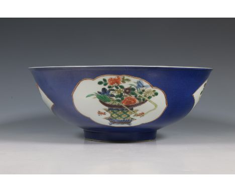 China, a powder-blue-ground famille verte porcelain bowl, 19th century, the exterior decorated with four cartouches enclosing