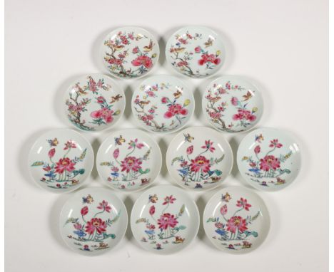 China, two sets of small famille rose porcelain saucers, 18th century, comprising seven saucers painted with a lotus pond and