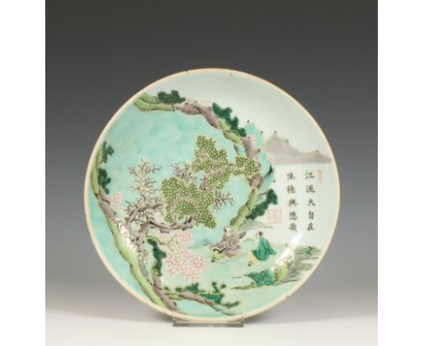 China, a famille verte porcelain plate, late Qing dynasty, early 19th century, decorated with a scholar playing qin to an att