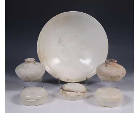 China, a collection of white-glazed cosmetics boxes and covers, two vases and a bowl, Song dynasty, 10th-12th century, the bo