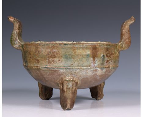 China, a green-glazed pottery censer, Han dynasty (206 BC- 220 AD), raised on tripod legs and with a pair of curved handles, 