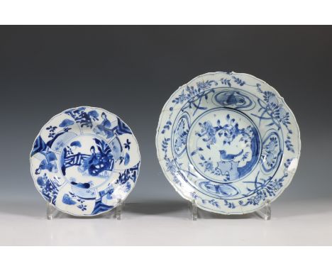 China, two blue and white porcelain deep dishes, Wanli and Kangxi period (1573-1722), the Wanli 'kraak' dish painted with a b