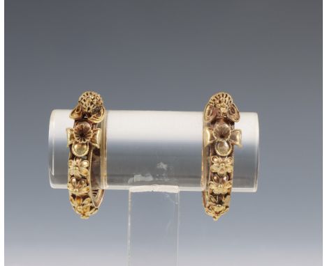 China, a pair of filigree gold earrings, Qing dynasty (1644-1912), each hoop earring with a band of filigree flowers, on pers