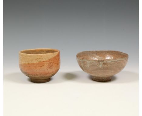 Japan, two Hagi ceramic tea-bowls, 19th century, one with small gold lacquer restoration, the second with two-coloured glaze 