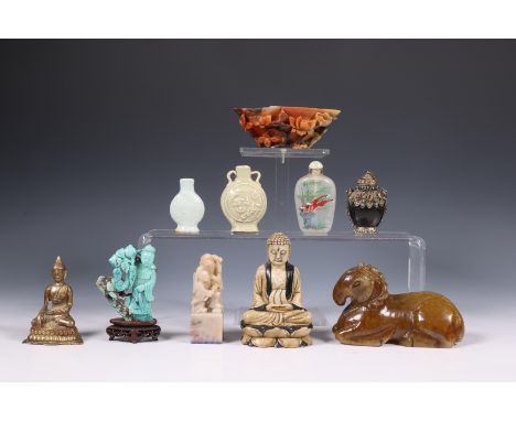 China and Asia, a collection of works of art, 19th-20th century, comprising a bronze Buddha, a stone Buddha, two stone figura