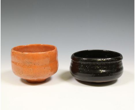 Japan, red Aka-Raku tea-bowl, chawan, and a black Setoguro tea-bowl both Taisho/ Showa period (1912-1989), the first with two