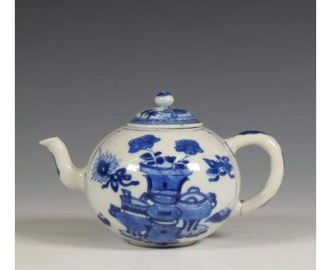 China, a blue and white teapot and matched cover, Kangxi period (1662-1722), the bulbous teapot painted with antiquities (cra