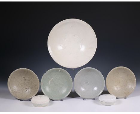 China, collection of celadon-glazed bowls, a dish and two cosmetics boxes and covers, Northern Song dynasty, 10th-12th centur