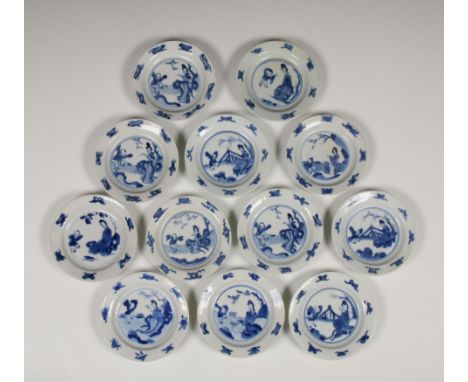 China, a matched set of blue and white porcelain saucer dishes, Kangxi period (1662-1722), each painted with a lady and a boy