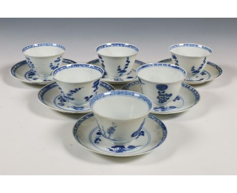 China, a set of five blue and white porcelain cups and saucers and a single cup, Kangxi period (1662-1722), the set painted w