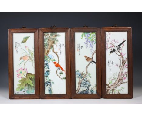 China, four polychrome porcelain 'bird' tiles, 20th century, each variously painted with a bird seated on a flowering branch,