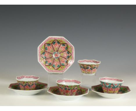 China, a near set of four famille rose porcelain octagonal cups and saucers, 18th century, each painted with a lotus pattern 