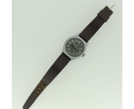 A Timor military issue Wristwatch, the black dial with Arabic hour markers and broad arrow, outer track and lume hour markers