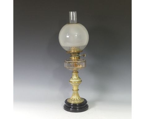 A Victorian Hinks patent brass Oil Lamp, having an opaque glass shade and clear glass font, on plinth base, nibbles to globe 