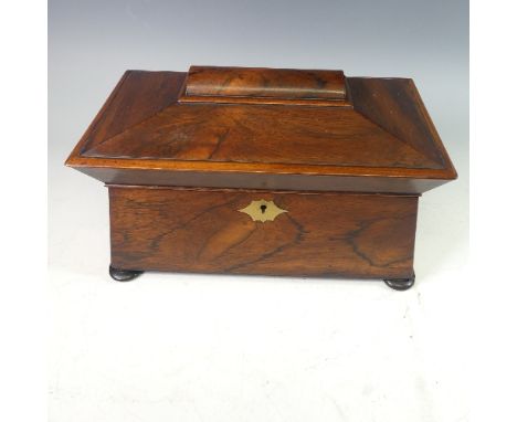 A George IV rosewood sarcophagus Tea Caddy, the hinged lid opening to reveal a fitted interior with two lined compartments fl