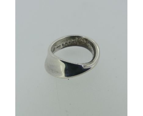 Georg Jensen; a silver Mobius Ring, design no. 148B, Size K, 4.6g. 