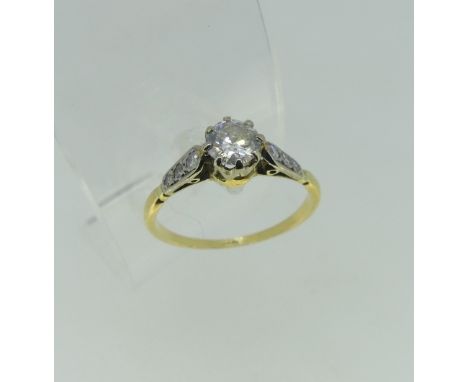 A single stone diamond Ring, the circular cut stone approx 0.52ct, with three graduated small diamonds on each shoulder, all 