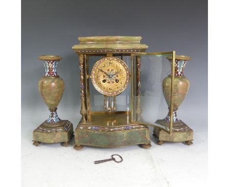 A late 19thC French green/red marble Clock garniture, the mantel clock of four-glass form with brass case and enamel decorati