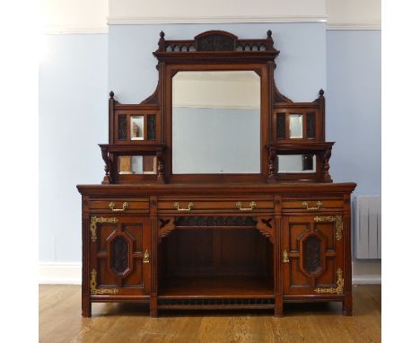 An Aesthetic Movement Maple &amp; Co mahogany Sideboard, the gallery back with a large central mirror, flanked by two smaller